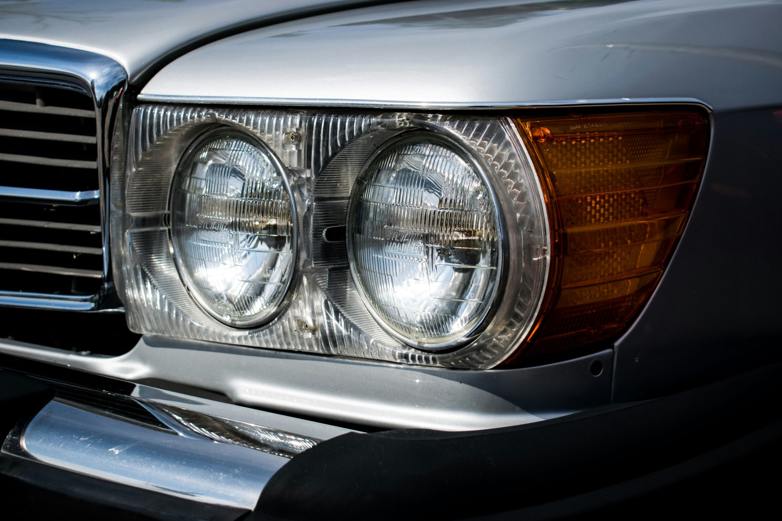 Old yellow headlights fixed on a car in Chappaqua, NY